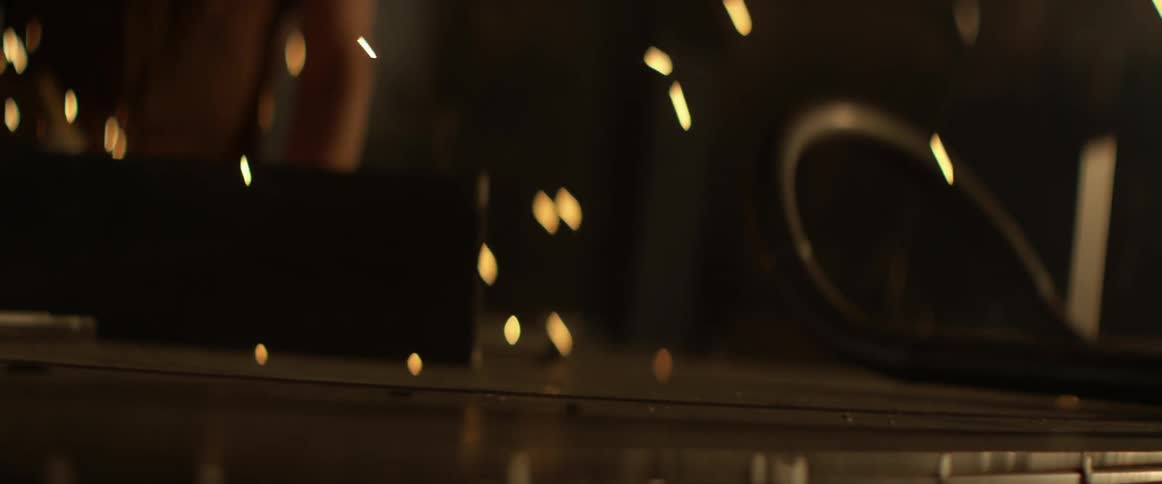 Sparks are flying as someone is working at a workbench