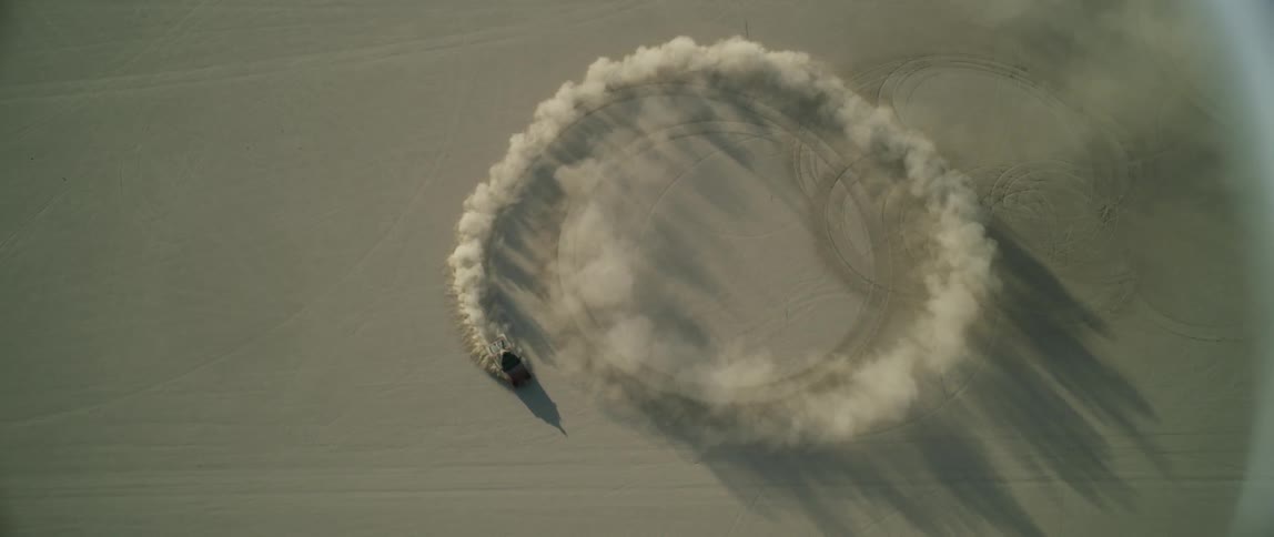 A person does donuts in the desert