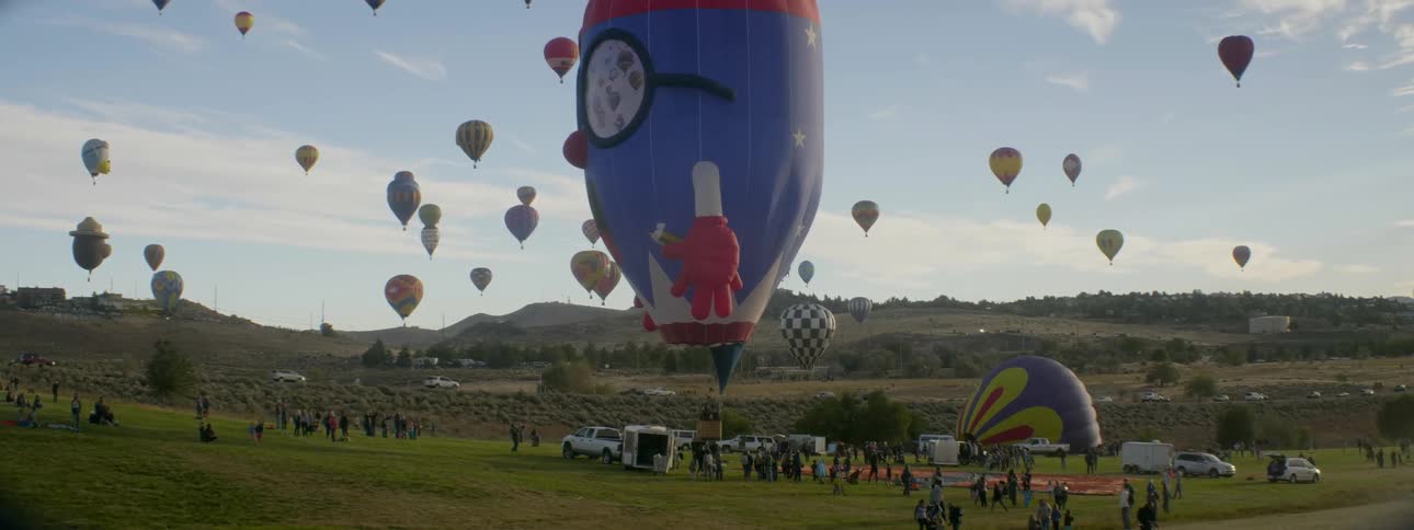 Hot air balloons float in the air