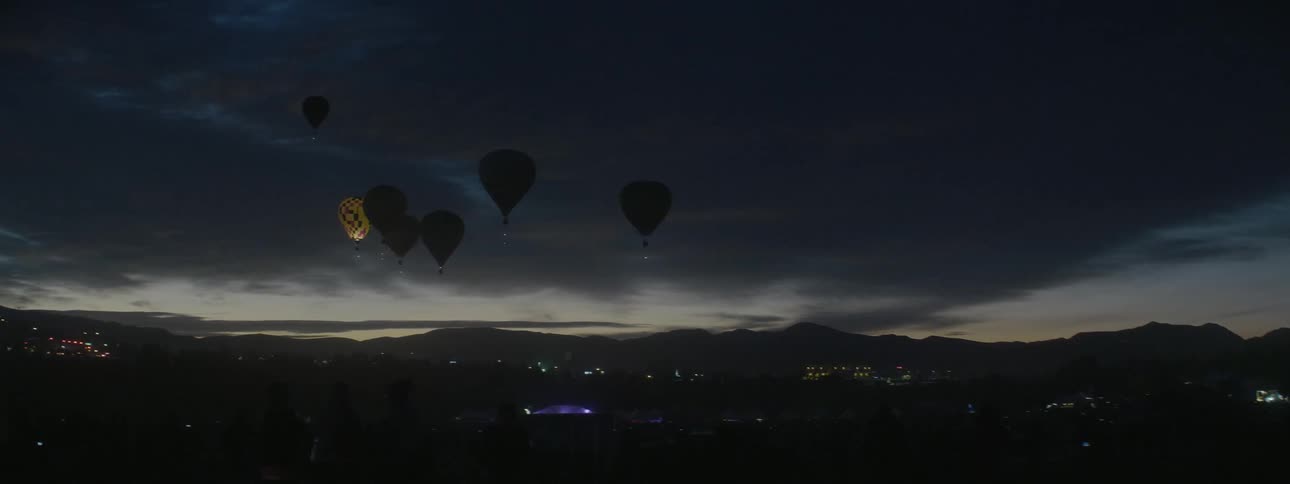 Hot air balloons in the night sky