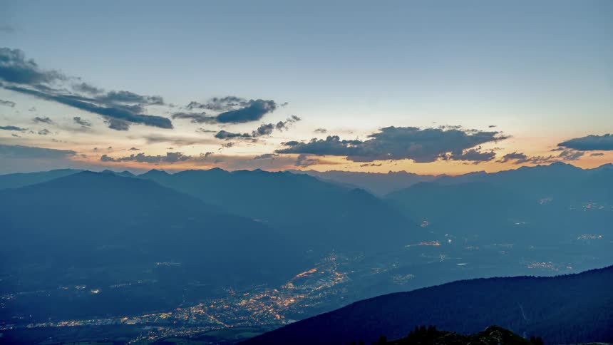 Time lapse of clouds forming over a small town
