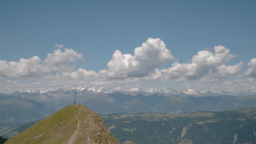Clouds float over a mountain range