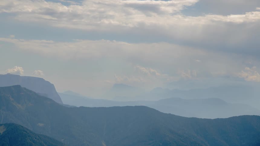 Clouds roll over mountains
