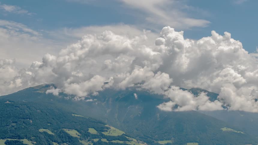 Clouds roll over a mountain range