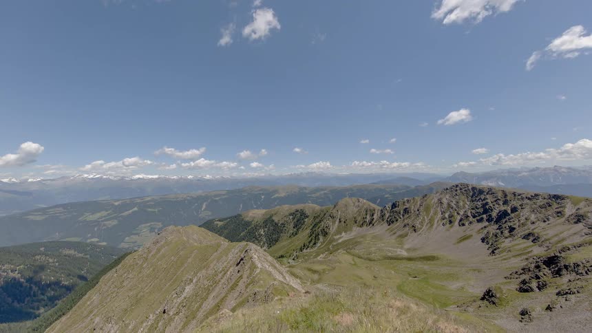 Clouds float over a mountain valley