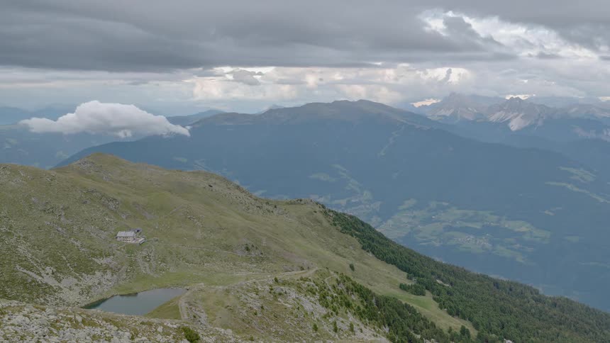 Clouds rolling over a valley