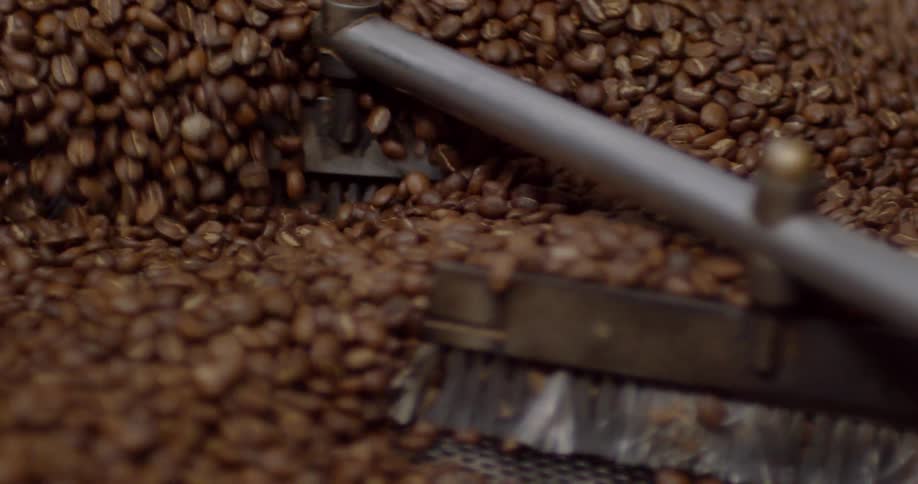 Coffee beans are cooked in a roaster