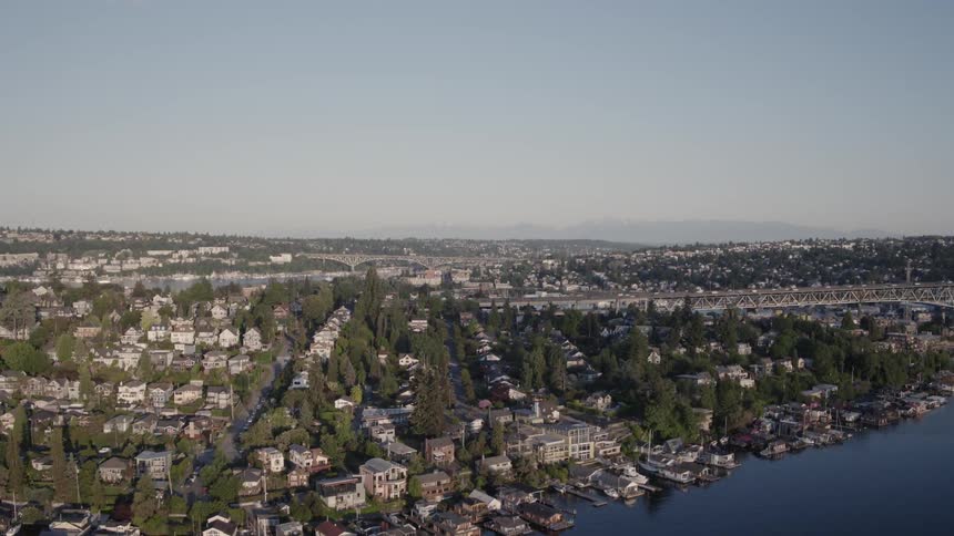 Ascent over the Portage Bay neighborhood to reveal Lake Union and Wallingford