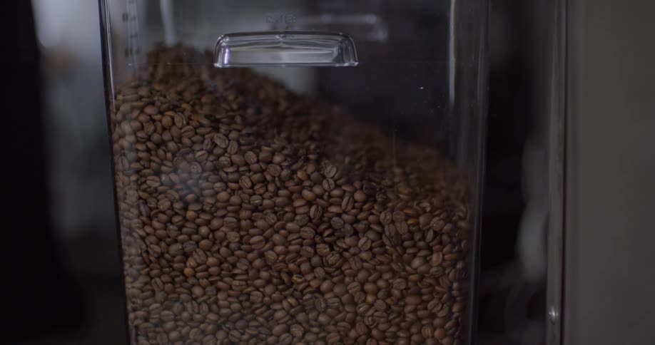Coffee is being pouring into the large container