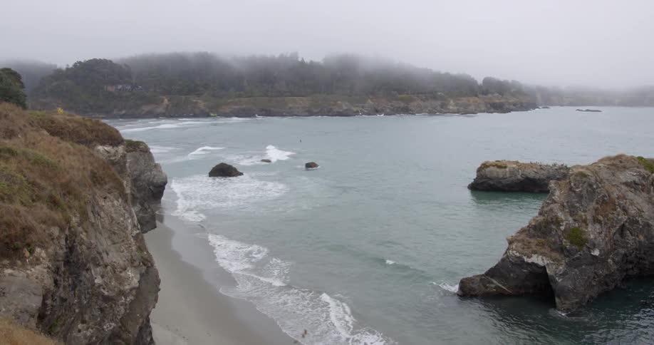 Waves flow onto the beach shore