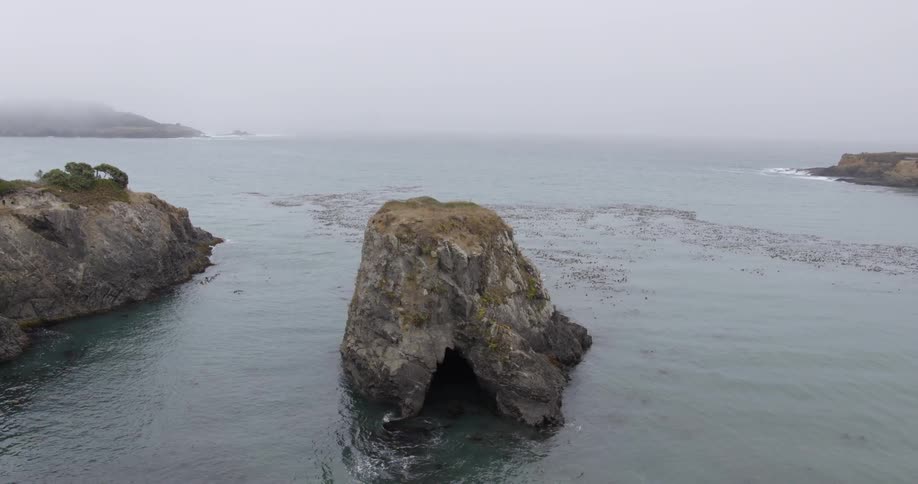 A small rock cave in the ocean