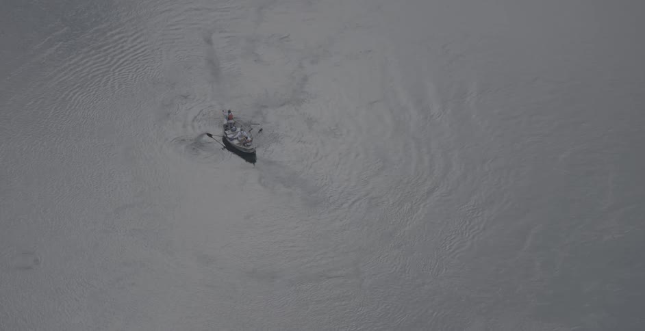 A boat is paddled in the water