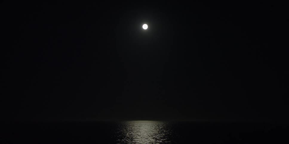 The moon is reflecting off of the water