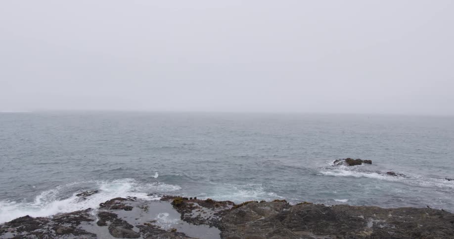 Waves flow onto the rocky shore