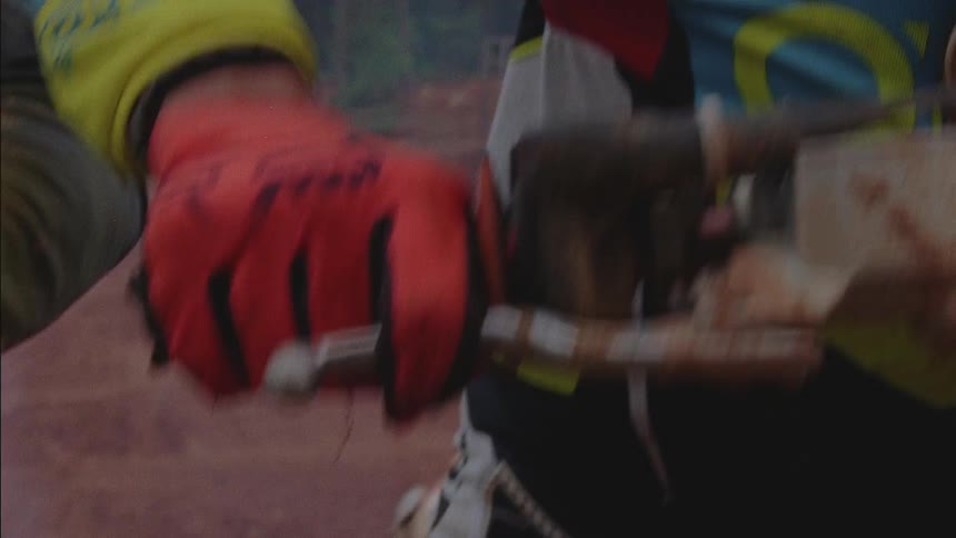 A person revs a dirt bike