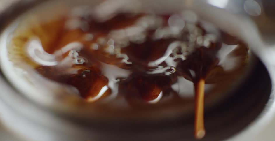 Coffee drips from a filter