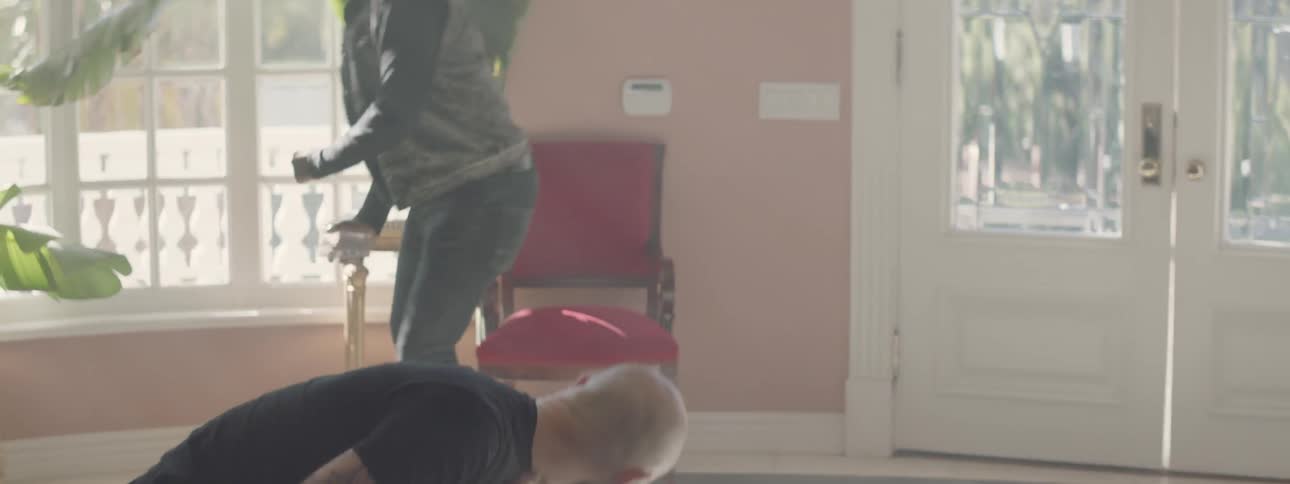 A man grabs an ashtray and hits another over the head