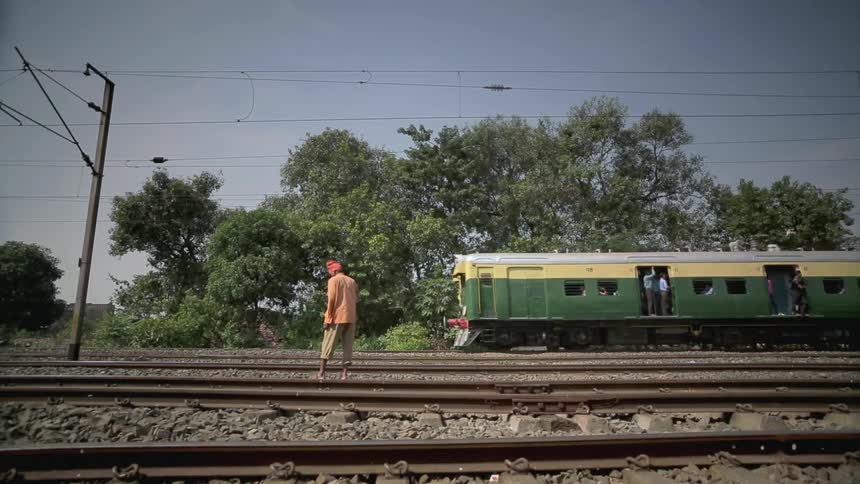 A train passing by a person