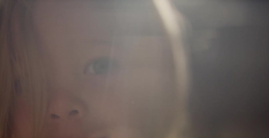 A child plays by the window
