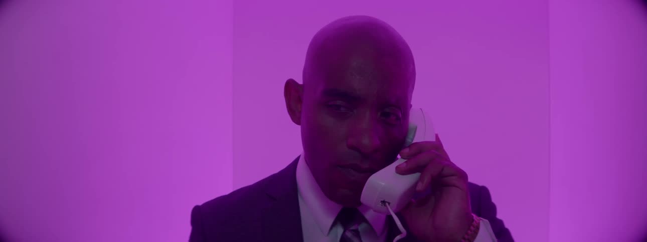 A man is talking on the telephone