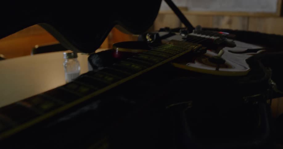 A guitar in its case on a table