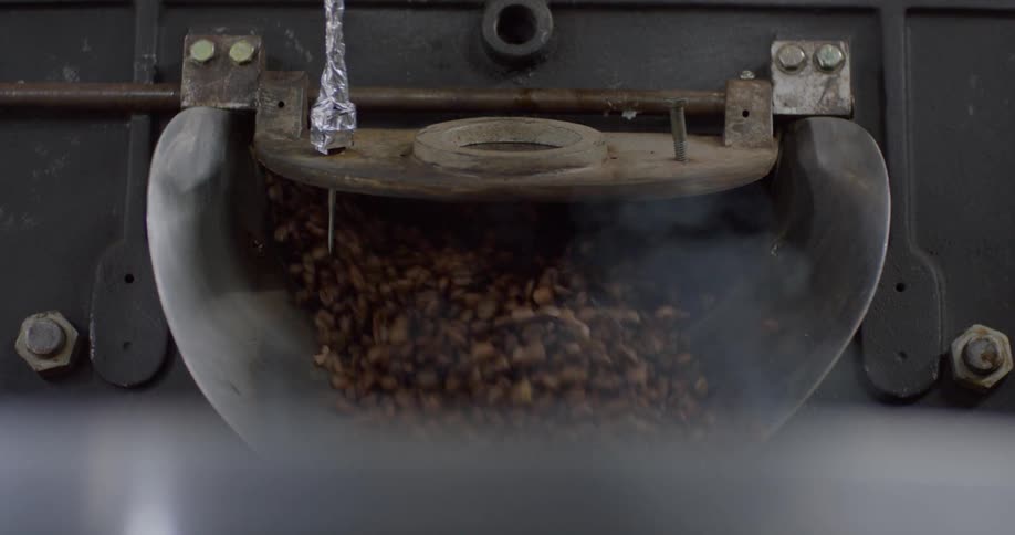 Coffee beans are shot down a chute