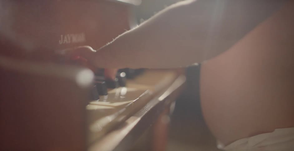 A baby is playing the piano
