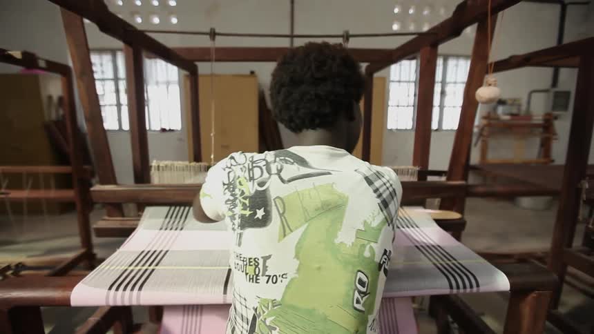 A person using a textile machine