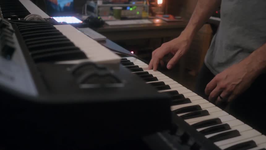 A man starts playing a keyboard