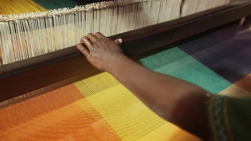 A person using a sewing machine