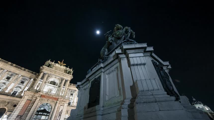 A statue near an elaborate building