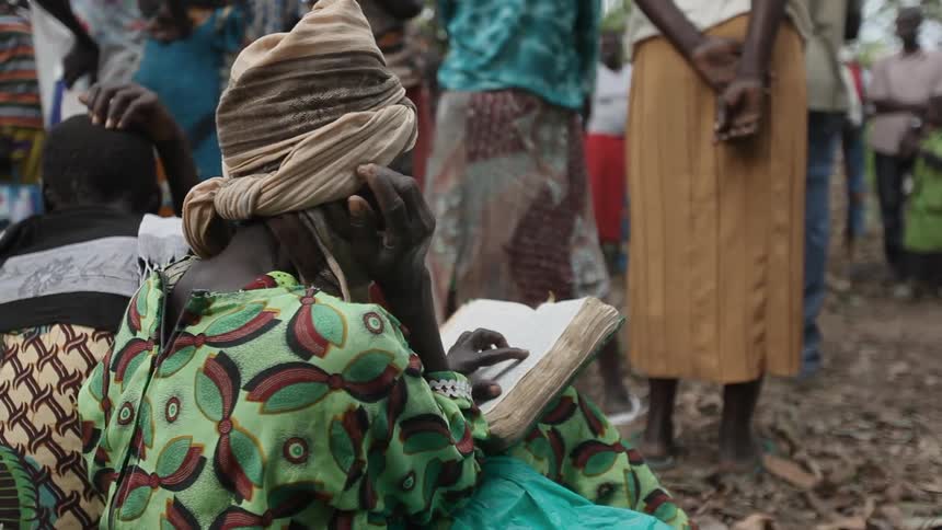 A person sitting down and reading a book