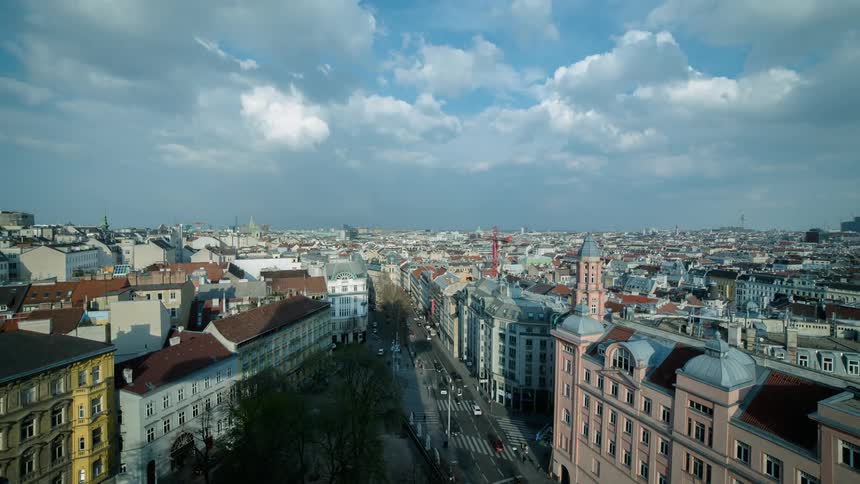Clouds roll past a busy urban area