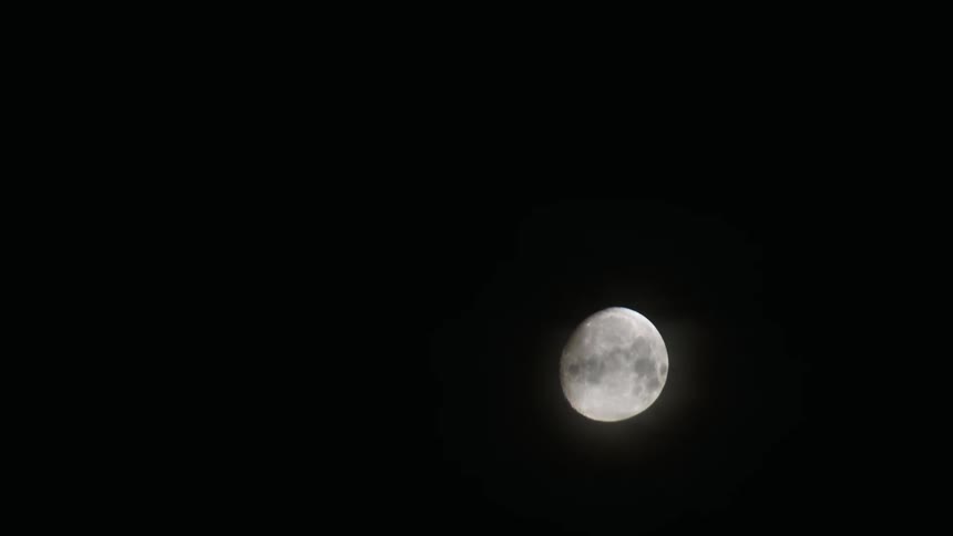 Moon descends across the night sky