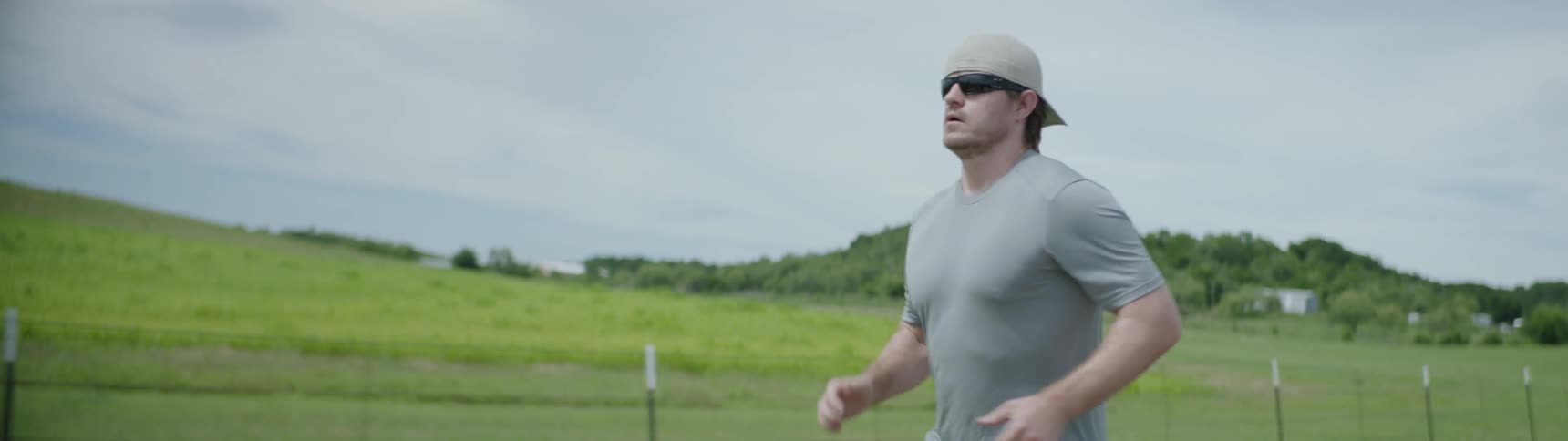 Man jogs down a country road