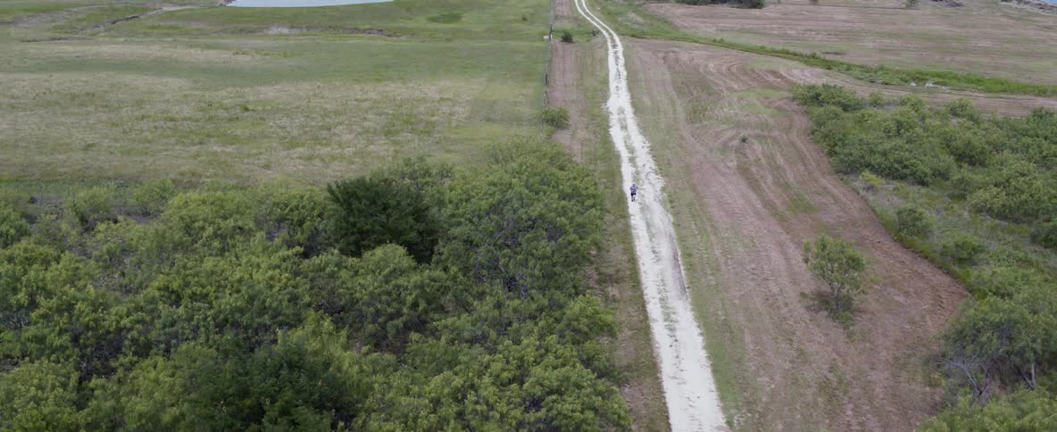 A man is running along the trail below