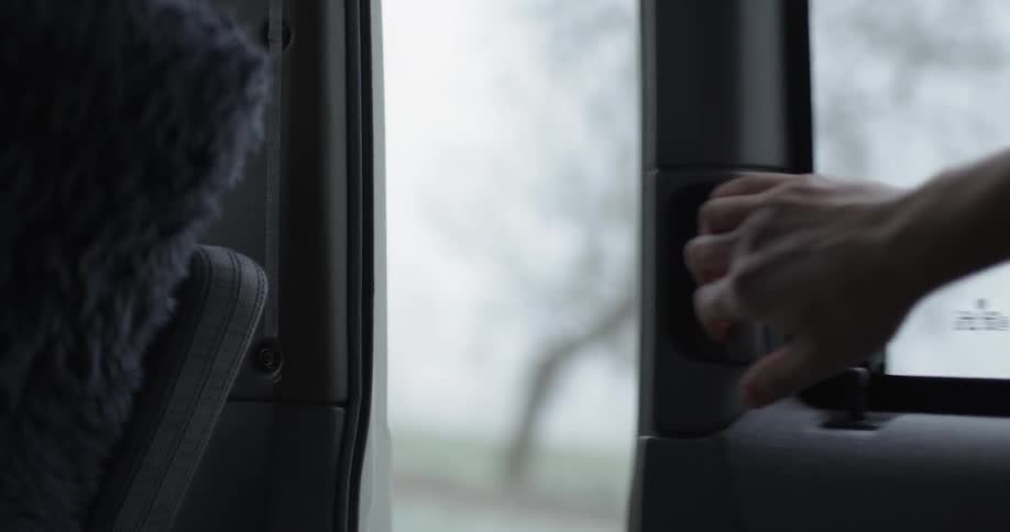 A man slides open a van door