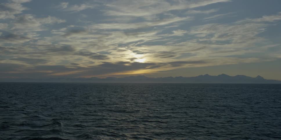 Ocean waves under setting sun