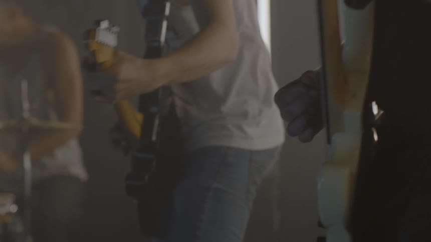 A rock band plays in a room