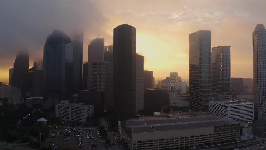 Tall city buildings tower into the sky