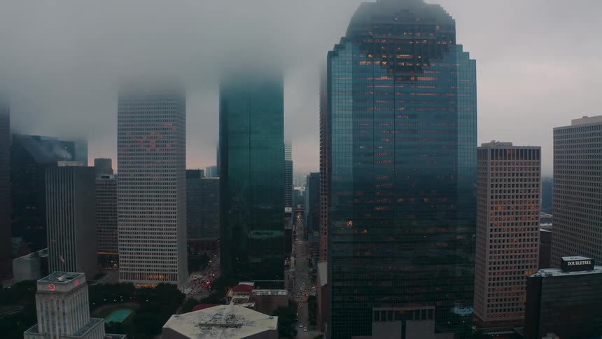 Skyscrapers reaching high into the sky on a cloudy day