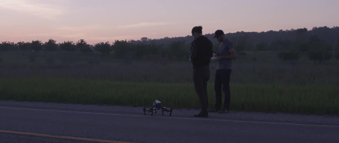 Some people using a remote control vehicle