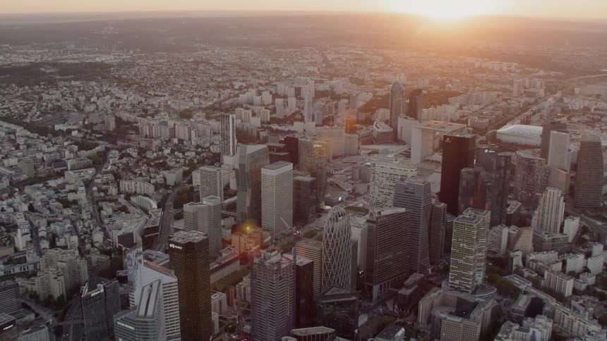 Sun rising over a large city