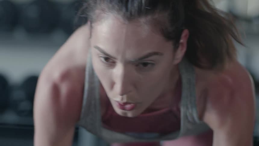 A woman is working out in the gym