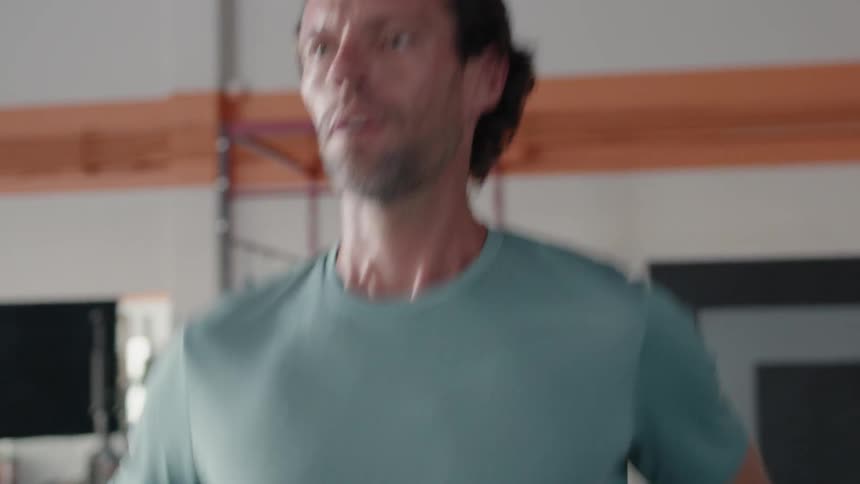 A man is exercising on a treadmill