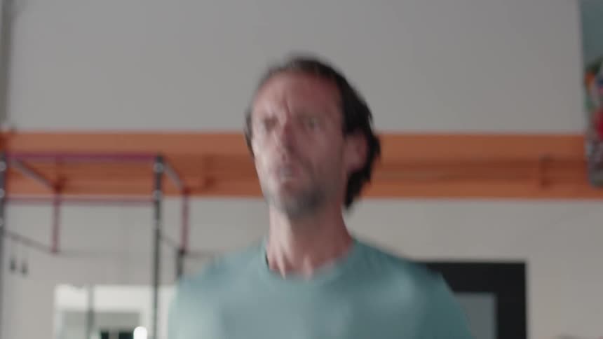 A man is running on a treadmill