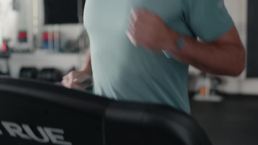 A man runs on a treadmill