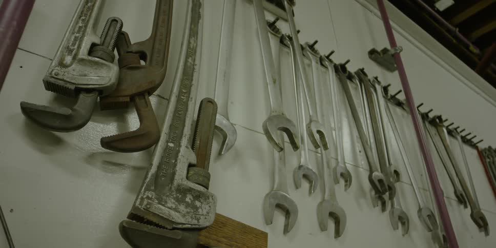 Tools swaying on a wall
