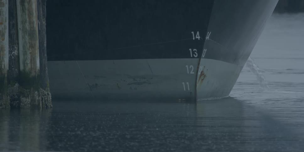 Ship floats on ocean during rain