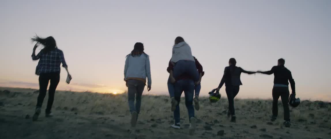 A group of people walk out in nature